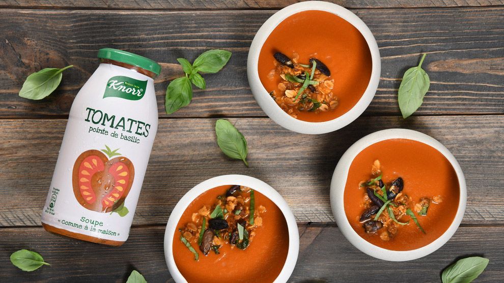 Knorr tomato soup in a glass container and poured into bowls