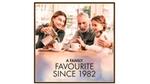 Image of a family at a table eating and talking.
