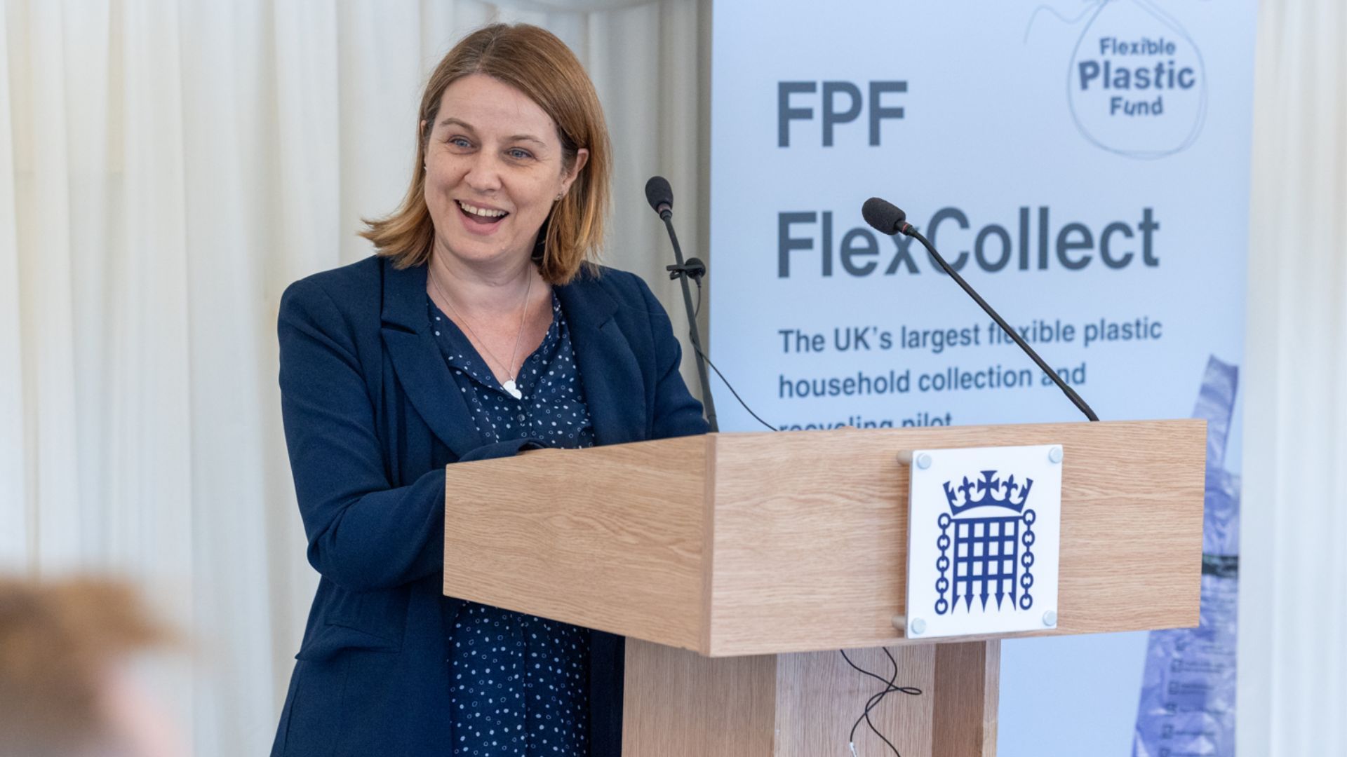 Person speaking from a podium