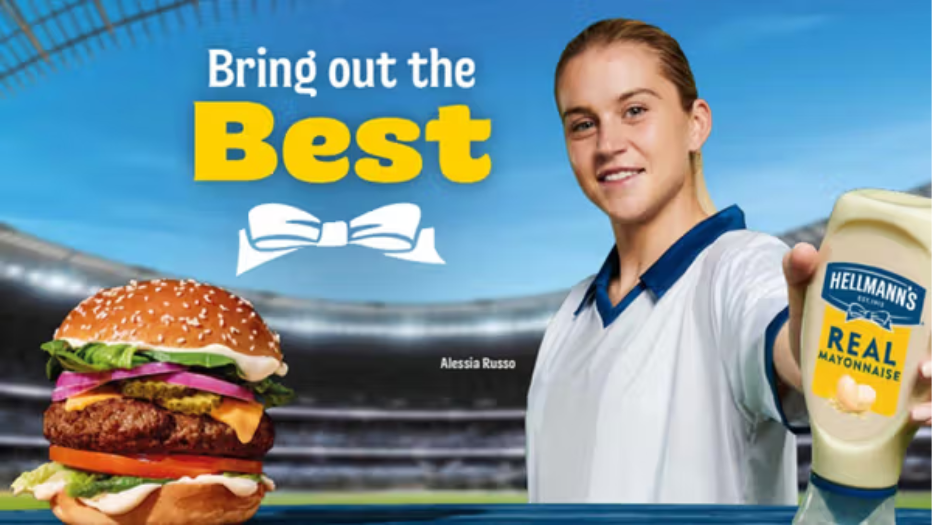 A burger and Hellmann's Real Mayonnaise is featured against a stadium backdrop, next to Alessia Russo.