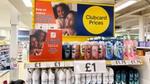 Promotional product stand in Tesco with Unilever products on the shelves