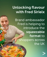 Brand ambassador Fred Sirieix pours sauce from a squeezable bottle into a vegetable noodle stir-fry.