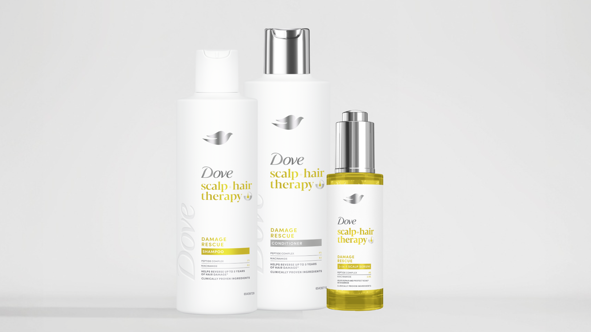 Dove Scalp + Hair Therapy Damage Rescue shampoo, conditioner and serum bottles.