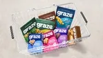 A shopping basket with Graze products.