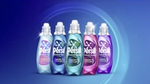 Five Persil Wonder Wash bottles on blue background.