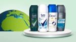 Four deodorant bottles (of the brands Sure and Dove) are displayed on a white platform with a globe in the background.