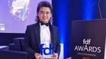 Richard holding FDF award trophy
