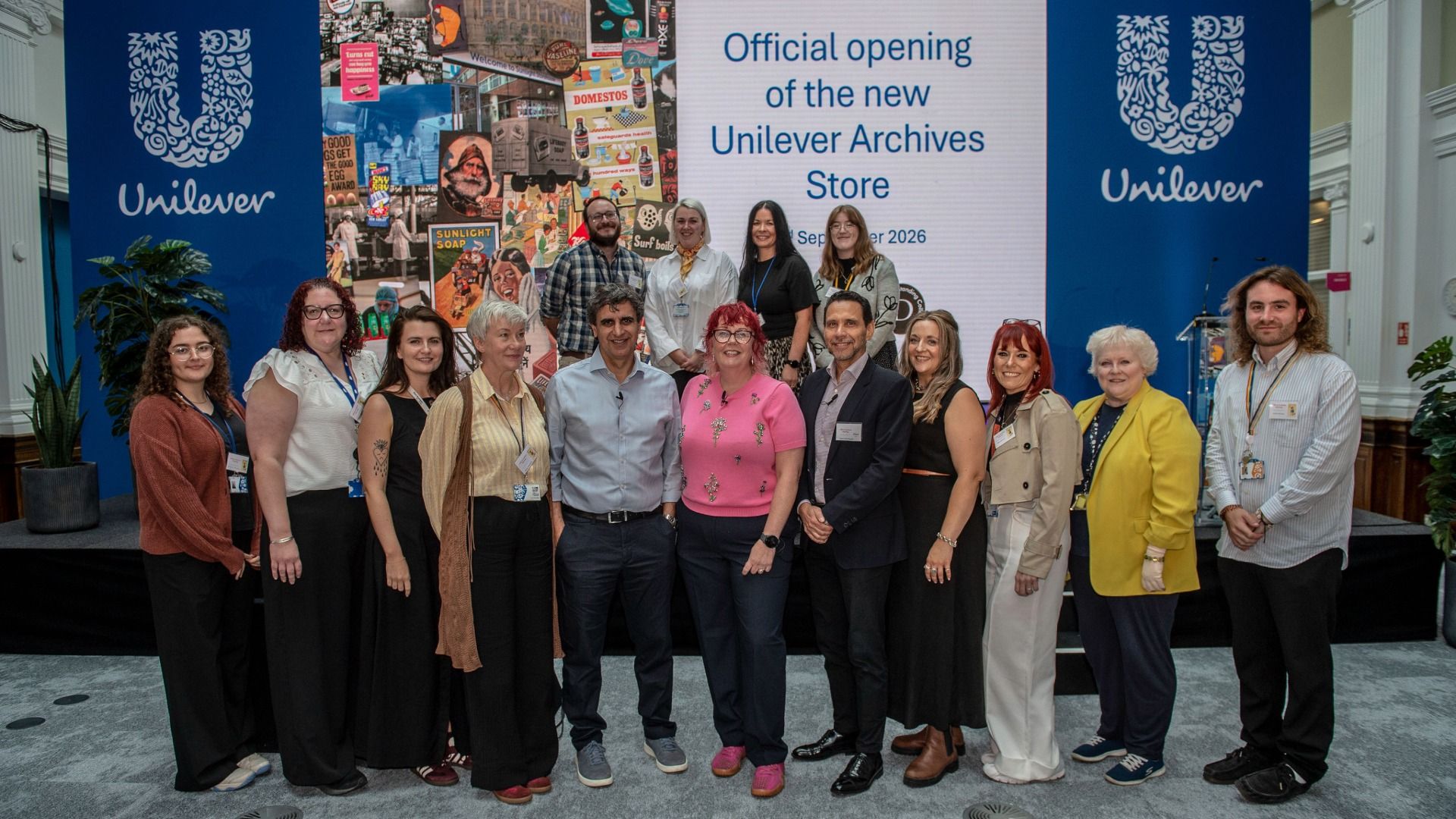 Fernando Fernandez, CEO of Unilever, stands with Unilever employees at the official opening of the Unilever Archive Store.