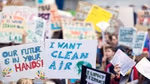 Image of children holding protest placards with Freedom to breathe on them