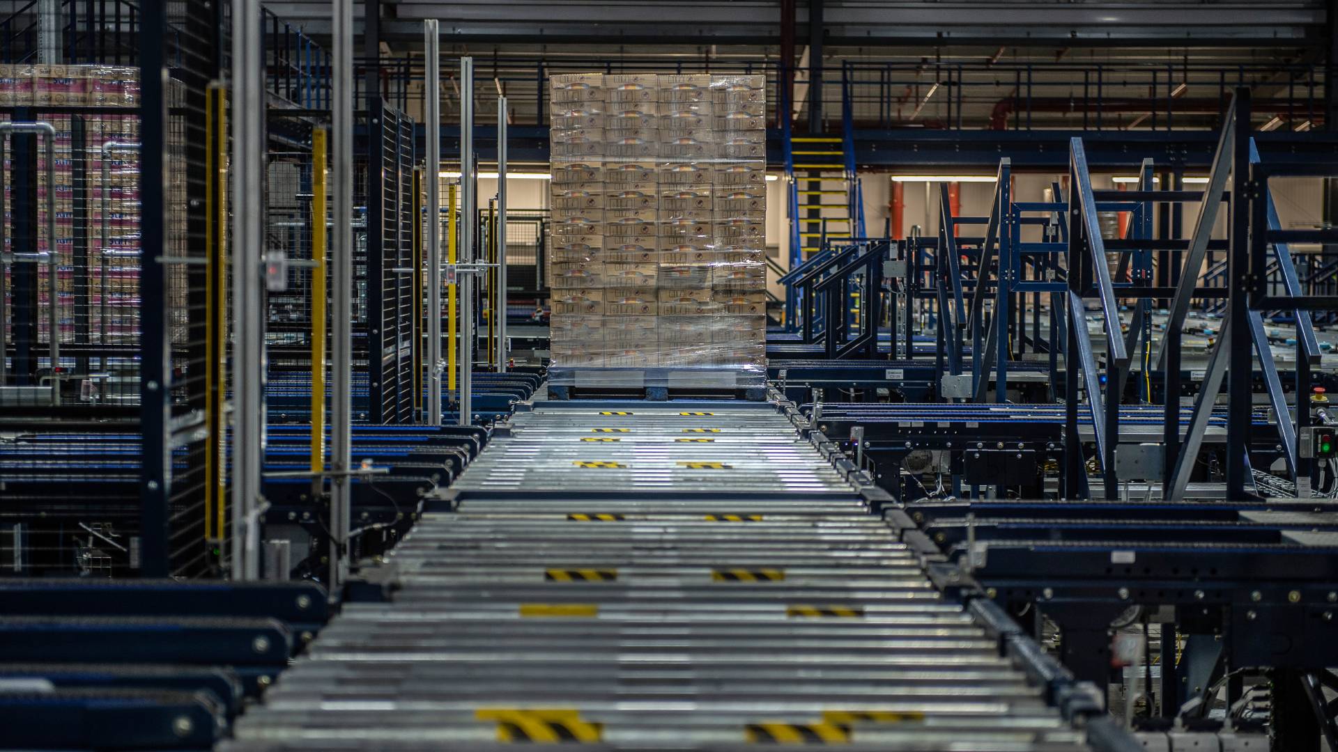 A pallet moving down a conveyer belt