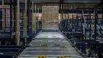 A pallet moving down a conveyer belt